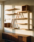 Six-piece cat wall shelf system mounted across a warm cream plaster wall