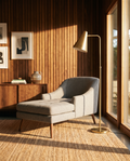 Ash grey pet chaise lounge with splayed walnut legs in a mid-century den