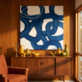Large square fractal floral canvas above a walnut sideboard
